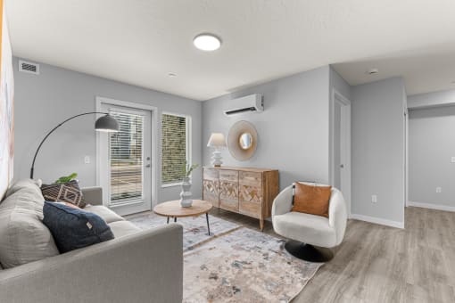 a living room with a couch and a chair