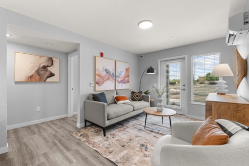 a living room with grey walls and a couch and a table