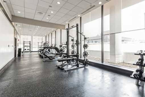 A spacious gym with a variety of equipment.