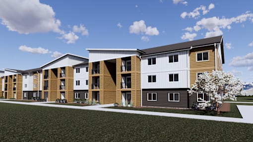 A modern building with a combination of white and wood exterior.