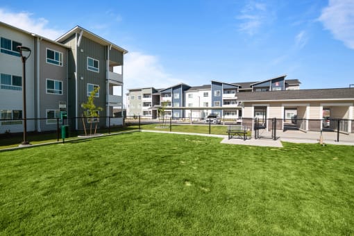 the preserve at ballantyne commons courtyard with grass and apartment buildings