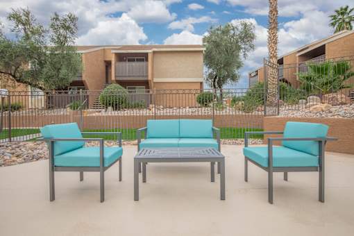 A set of outdoor furniture is placed on a patio.