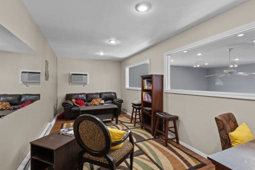 a living room with a couch and a table and a window