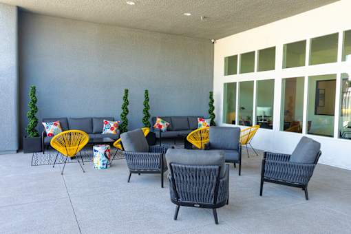 A set of outdoor furniture is arranged on a patio.