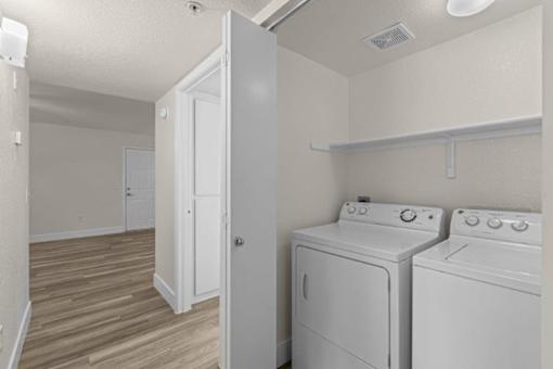 A laundry room with a washer and dryer.