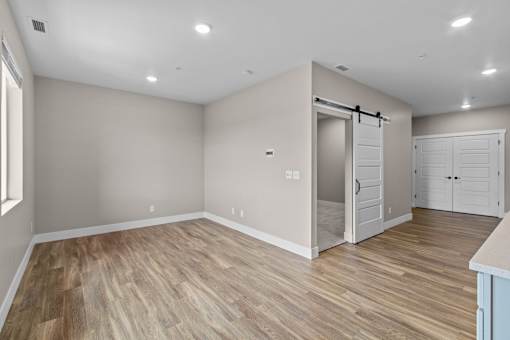 a bedroom with a medium sized bed and a closet with a sliding door