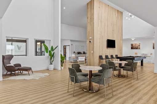 a living room filled with furniture and a flat screen tv