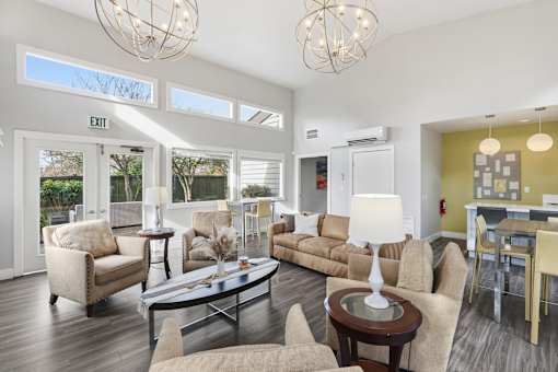 A living room with a sofa, chairs, and a coffee table.