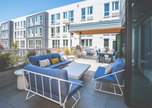 Meetinghouse Apartments Outdoor Lounge Area and BBQ Grill