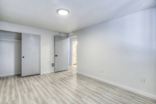 Oasis at 2600 Vacant Empty Bedroom with hardwood floors