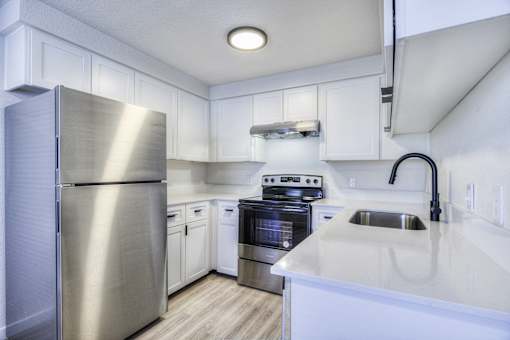 Oasis at 2600 kitchen with stainless steel appliances