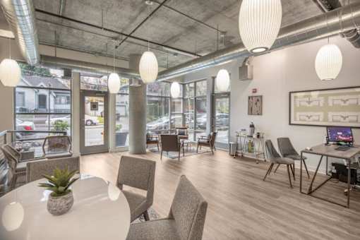 A modern office space with a view of the street outside the windows.