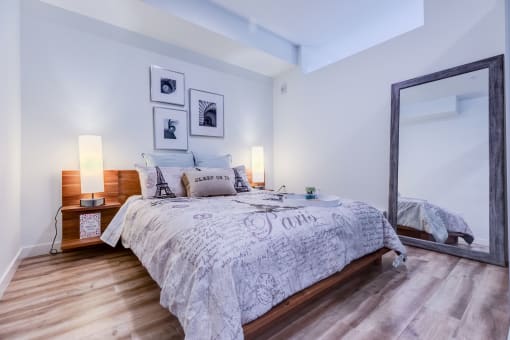 a bedroom with a large mirror and a bed at Wilcox, Seattle, Washington