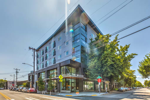 a large building on the corner of a city street at Wilcox, Seattle, Washington