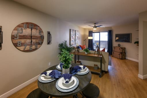 an open living room and dining room with a table and chairs