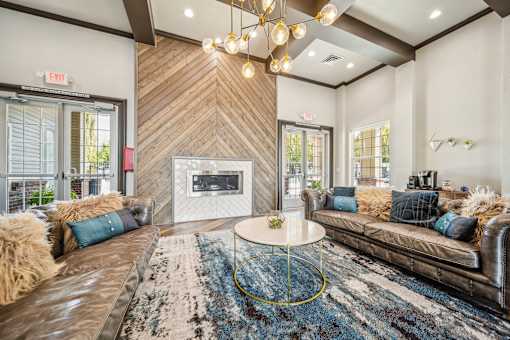 A living room with a fireplace and a couch.