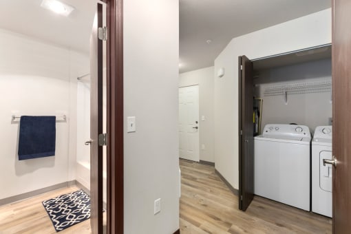 Pioneer Meadows Washer and Dryer Closet and View into Bathroom