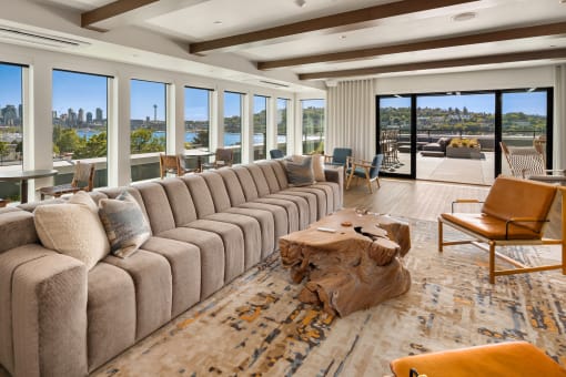 a large living room with a large couch and a table at Liza Apartments, Seattle, 98102