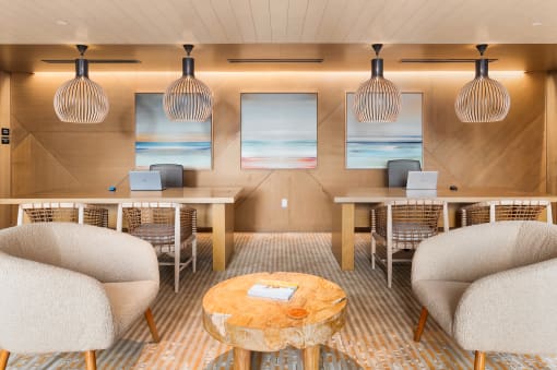 a lobby with chairs and tables and a reception desk at Liza Apartments, Washington