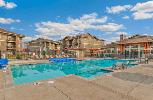 RedPoint Apartments Pool with Lounge Chairs