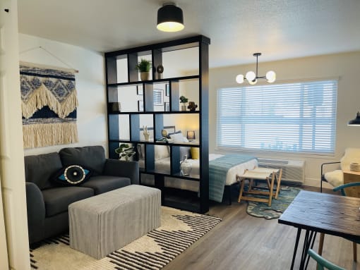 a living room and dining room with a couch and a table