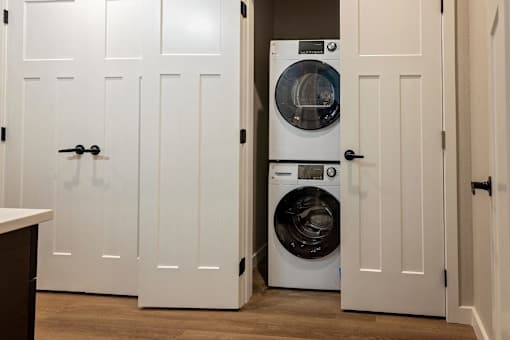 A white door with a black handle is open.