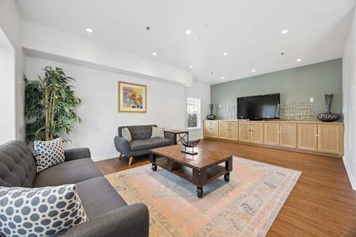 Community clubhouse with tv and seating at Springwater Crossing apartments in Gresham, Oregon 97030