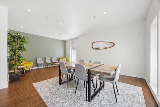 Community clubhouse long dining table with seating at Springwater Crossing apartments in Gresham, Oregon 97030