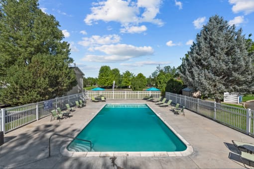 the swimming pool at woodland park apartments