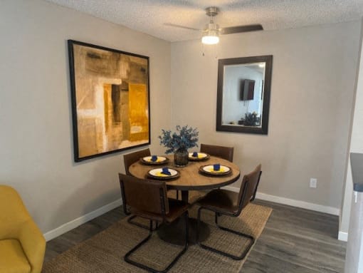 a dining room with a table and chairs