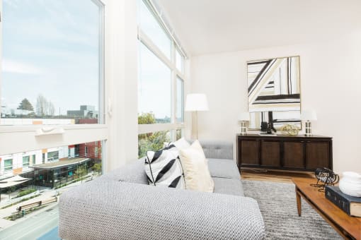 The Hayes on Stone Way Apartments living room with large windows at The Hayes on Stone Way, Seattle