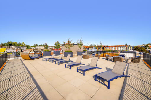 a row of lounge chairs on a roof top patio at The Hayes on Stone Way, Seattle, Washington