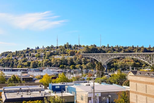 The Hayes on Stone Way Apartments view of the city with a bridge over the water and buildings at The Hayes on Stone Way, Seattle, WA