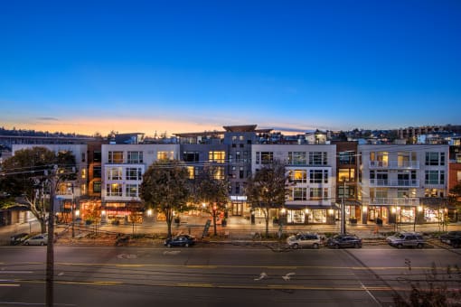 an aerial view of a city street at night with buildings at The Hayes on Stone Way, Washington, 98103