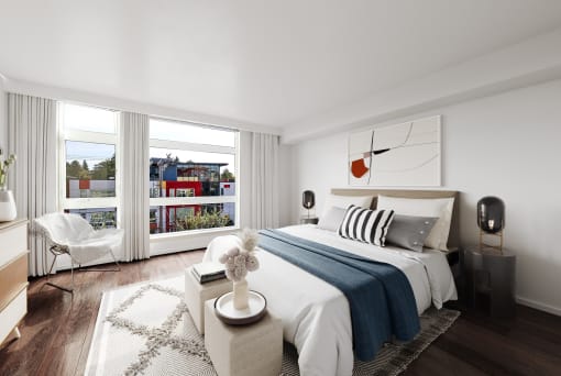 a bedroom with a bed and a large window at The Hayes on Stone Way, Seattle, Washington