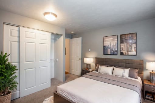 a bedroom with a bed and a closet
