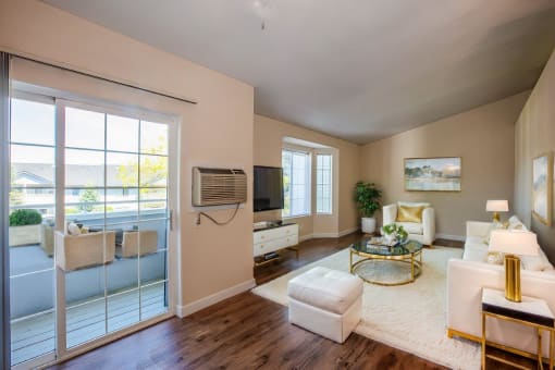 a living room with a door to a balcony