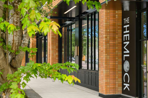 a building with a tree in front of it at The Hemlock, Seattle 
