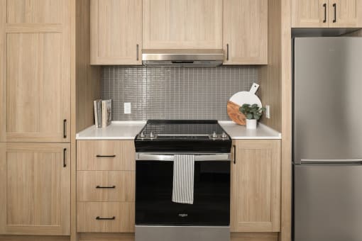 a kitchen with a stove and a refrigerator at Liza Apartments, Seattle, Washington, 98102
