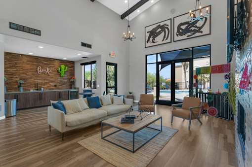 A modern living room with a wooden floor and a large window.