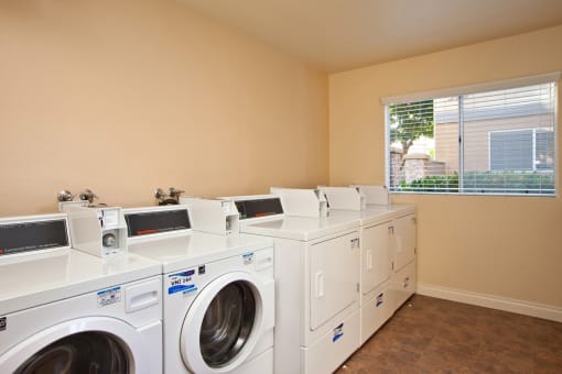 washing machines and dryers in the laundry room of a home