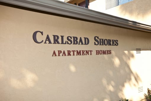 the exterior of the carlsbad shores apartment homes building