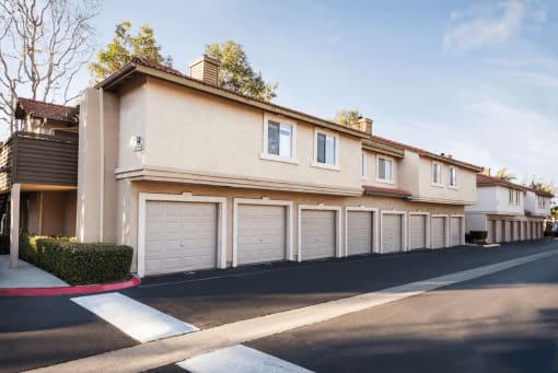 a row of townhomes with garages