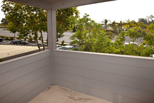 a small porch with a view of the parking lot