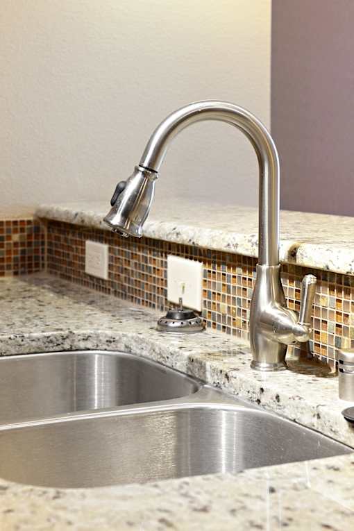 Kitchen sink with a chrome faucet at H Squared Apartments, Denton, TX, Texas, 76201