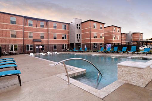 Pool With Relaxing Chair at The Liberty Lofts, Gainesville, TX