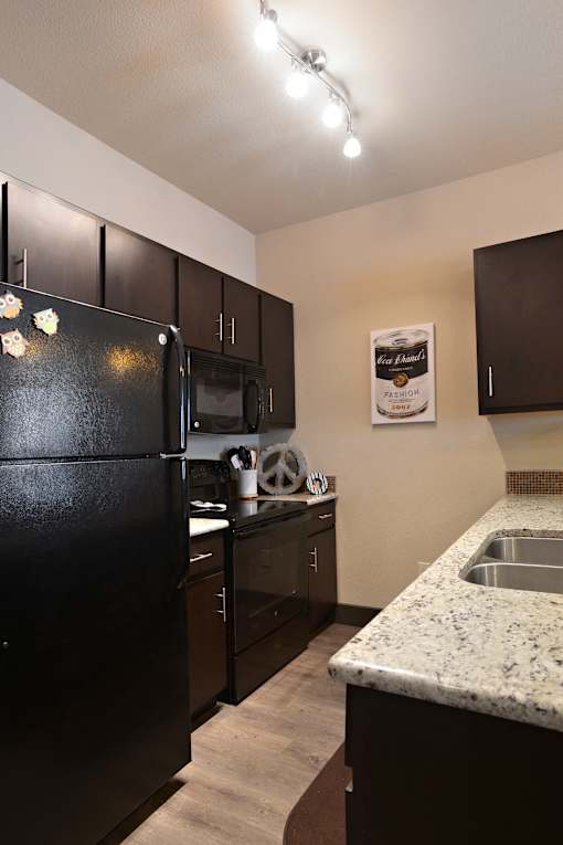 Modern Kitchen With Double Door Refrigerators at H Squared Apartments, Denton