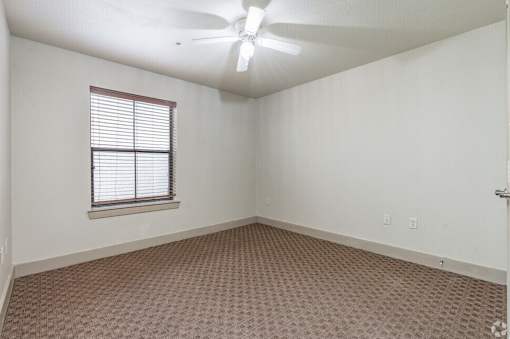 Empty room with wooden floor at Hickory Street Lofts Apartments, Texas