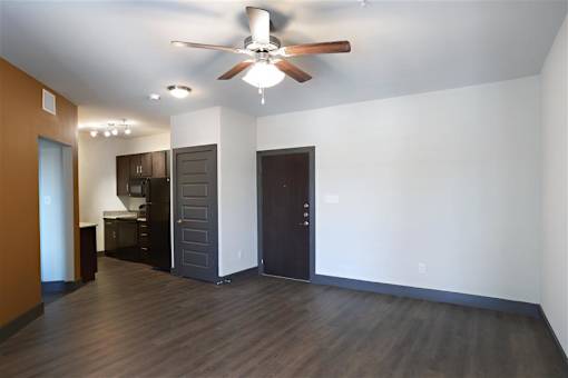Living Room with Plank Wood Style Flooring at H Squared Apartments, Denton, Texas