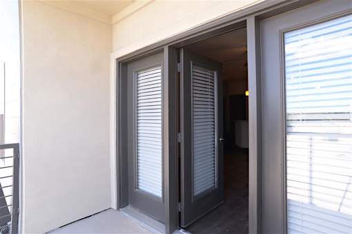Sliding Glass Door to Patio at H Squared Apartments, Denton, TX, 76201